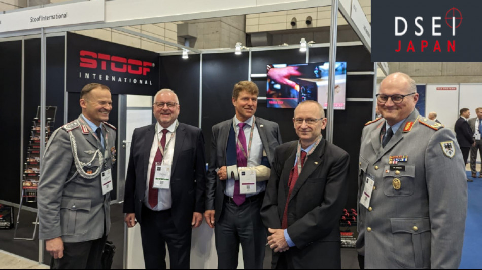 Fred Stoof of Stoof International presents armoured world novelties to government representatives at the DSEI Japan Makuhari fair in Tokyo