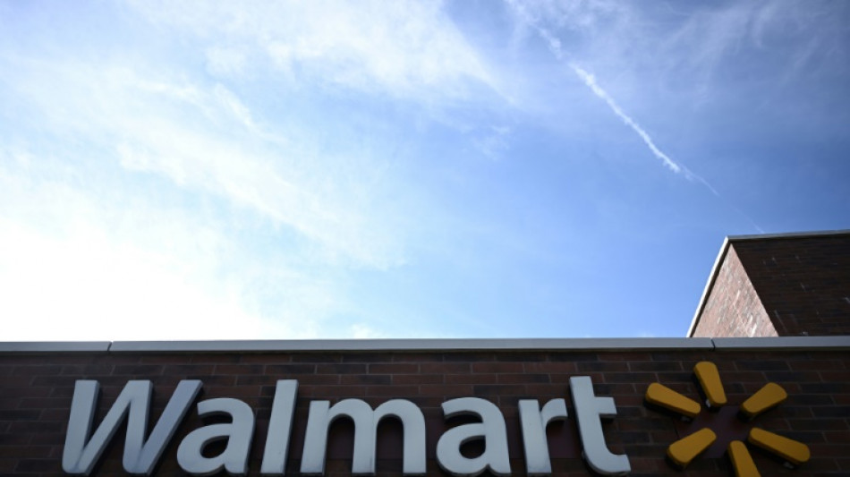 Walmart lifts outlook on strong earnings but hit by opioid settlement