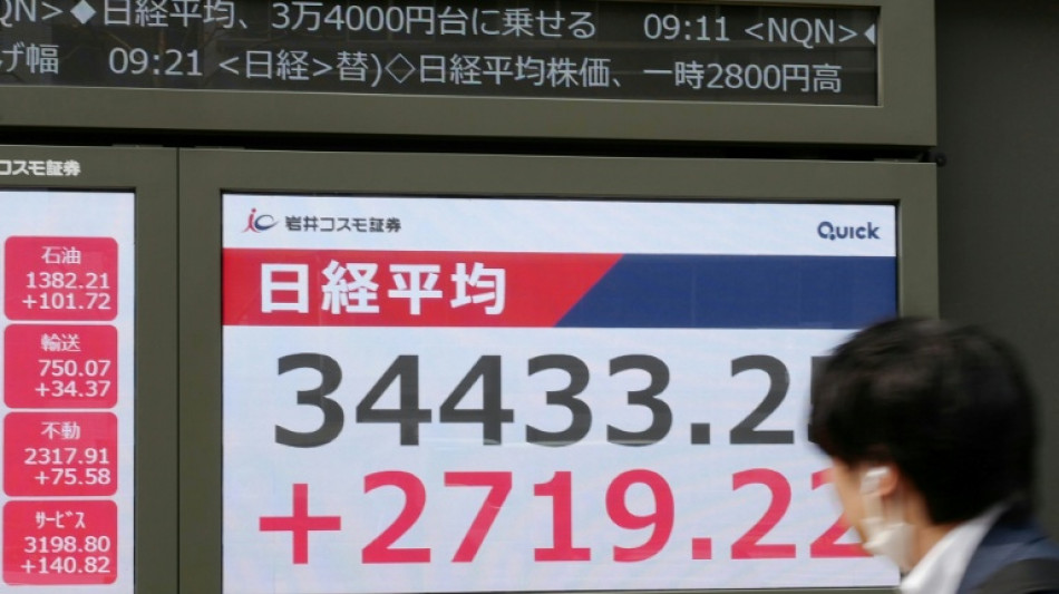 Asian stocks crack higher as Trump delays painful tariffs