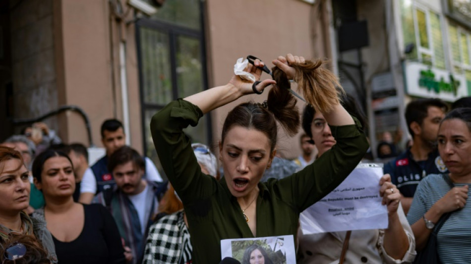 Woman cuts hair at Istanbul protest for Iran's Amini