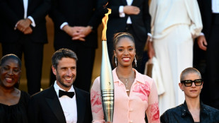 Olympic torch ascends Cannes red carpet
