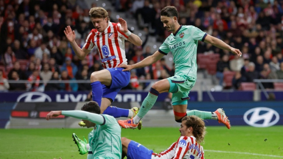 Griezmann double earns Atletico battling win over Levante