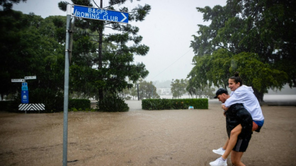 Rooftop rescues as tens of thousands evacuated from Australia floods