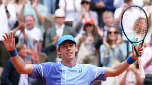 Medvedev knocked out of French Open by De Minaur
