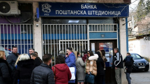 Kosovo's Serbs hit by lines, limited withdrawals after currency ban