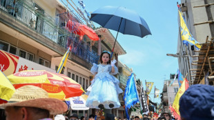 Child mascots and bun towers: Hong Kong keeps island traditions alive