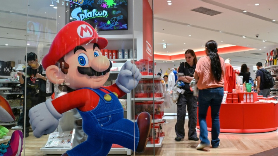 Gold nears $5,000, silver shines as stocks slip on turbulent week