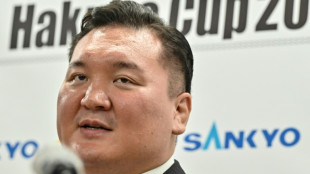 Sumo great Hakuho demoted over protege's bullying