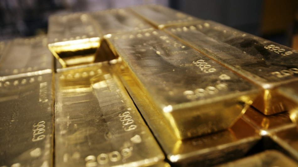 Stocks waver, gold futures hit record on US tariff updates