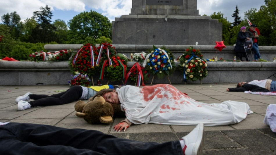 Activists hold 'die-in' protest at Soviet monument in Warsaw
