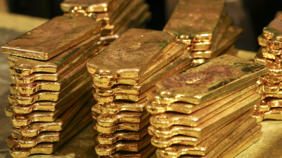 Gold hits high, stocks retreat as investors seek safety