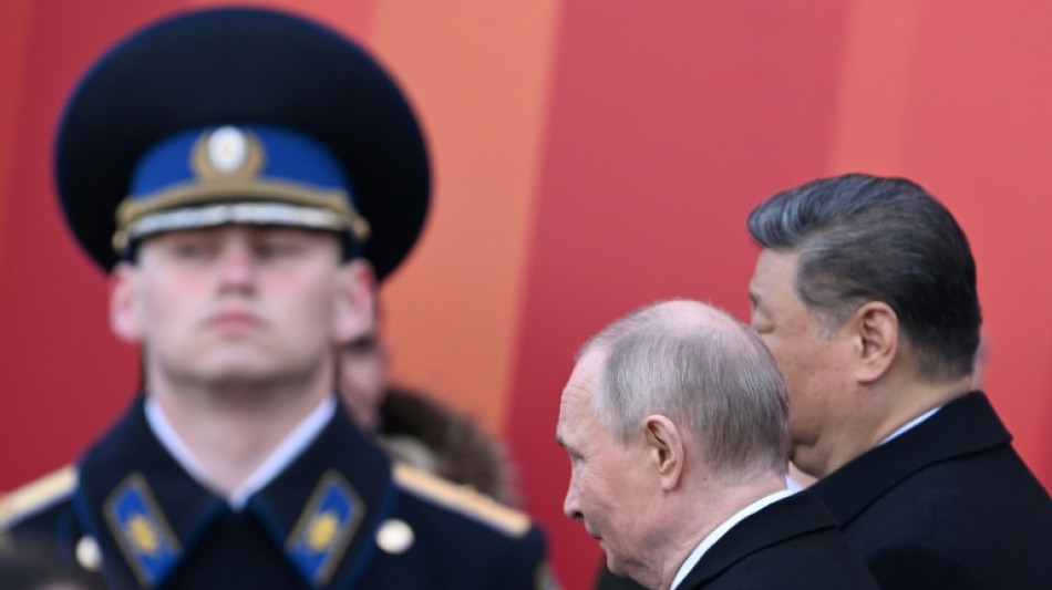 Putin hails troops fighting in Ukraine as foreign leaders attend parade