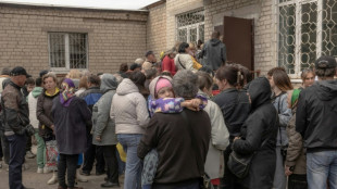 'Get out now': Kharkiv region evacuees wait for stranded relatives