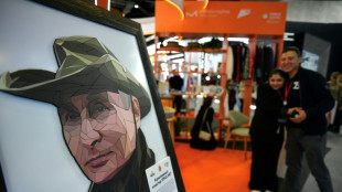 Putin T-shirts, robots and the Taliban -- but few Westerners at Russia's Davos