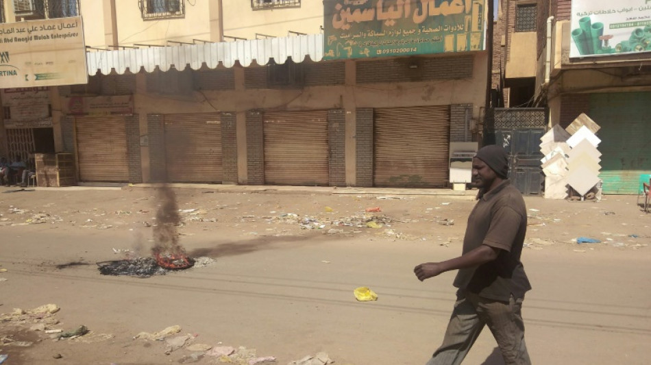 Sudanese barricade streets, close shops after 7 killed