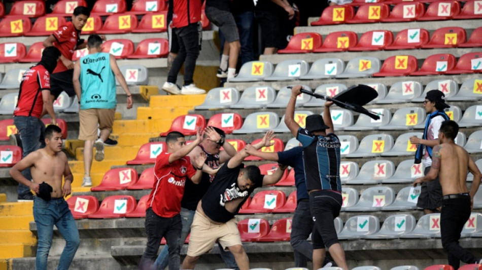Mexico bans away fans after football violence suspended match