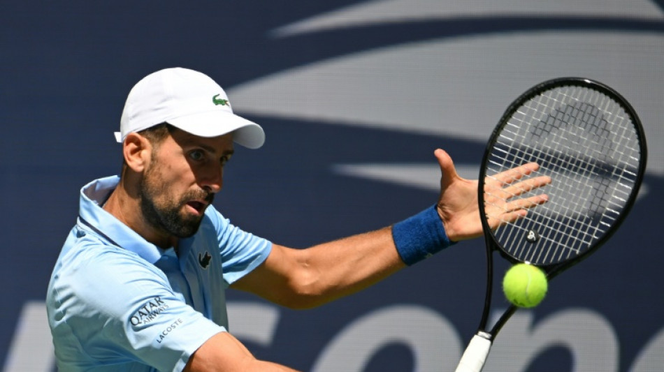 Djokovic fights off qualifier to make US Open third round