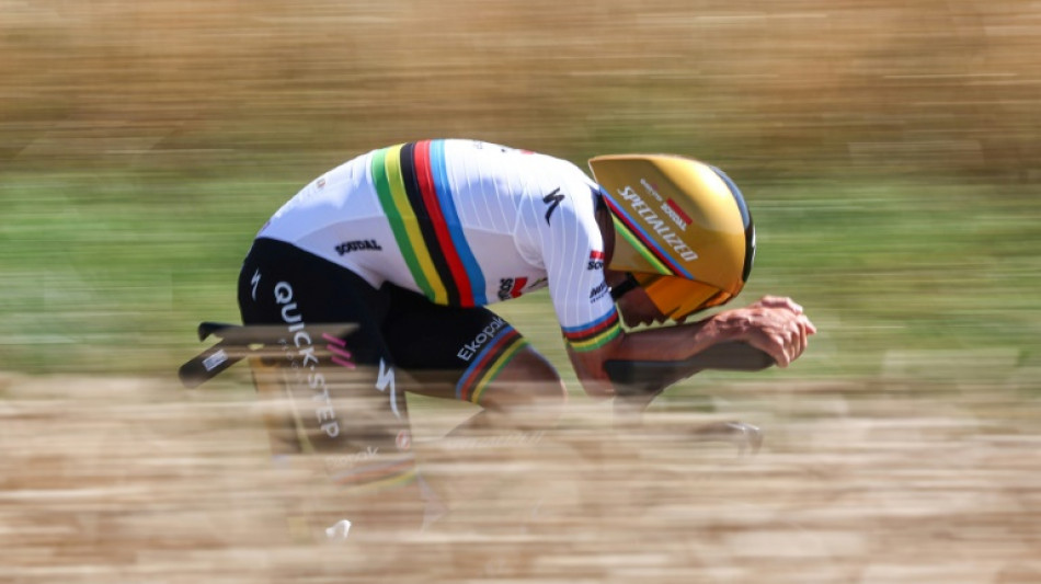 Evenepoel triumphs in Tour de France time trial as Pogacar slips into yellow