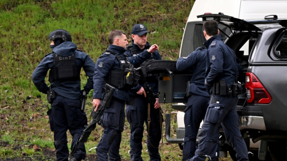 Wife of Australian man wanted in police killings urges him to surrender