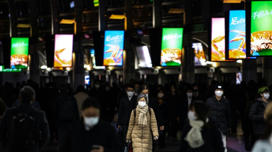 Japan brings back virus restrictions over Omicron surge