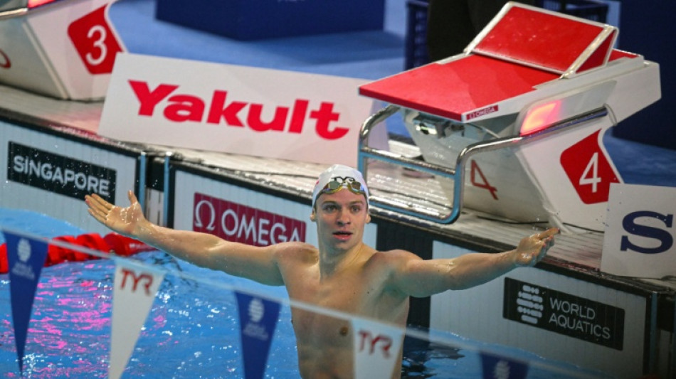 Marchand shatters record as US, Australia win more world gold