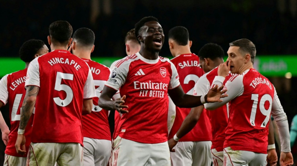 Two own goals save Arsenal blushes against Wolves