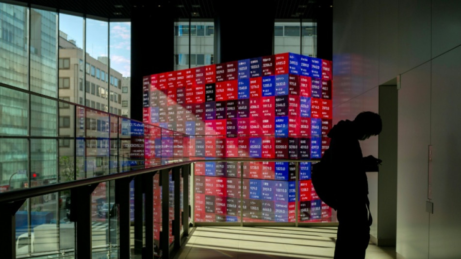 Asian markets drop with Wall St as tech fears revive