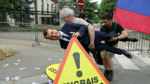 Greenpeace steals Macron wax figure for anti-Moscow protest