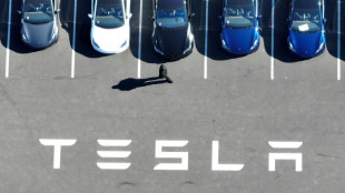 Global stocks mostly rise on trade deal hopes while Tesla plummets