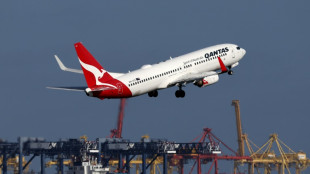 Qantas says profits down but reputation rebounding