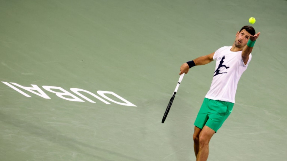 Djokovic finally gets season underway to loud cheers in Dubai