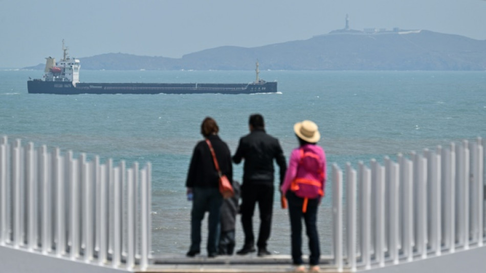 Chinese tourists pine for Taiwan's return as Beijing jets surround island