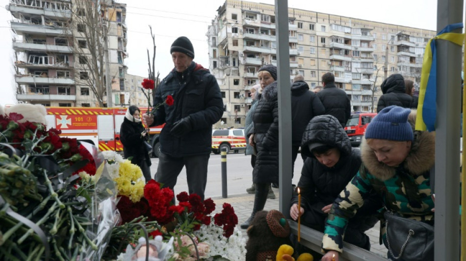 Dnipro mourns dozens of victims of tower block missile strike 